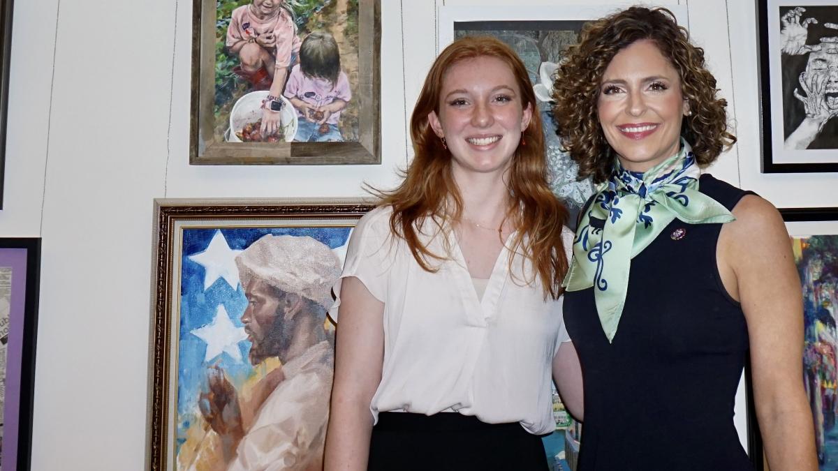 Congresswoman Julia Letlow with Madison DiCarlo's piece "Summer Strawberries"